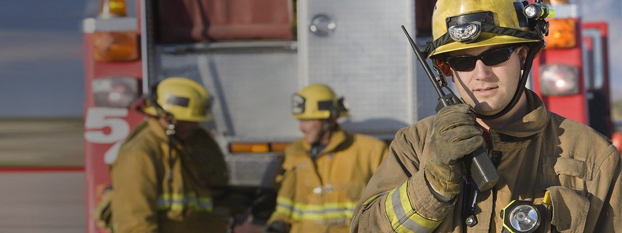 Full|Group of firefighters on-scene communicating