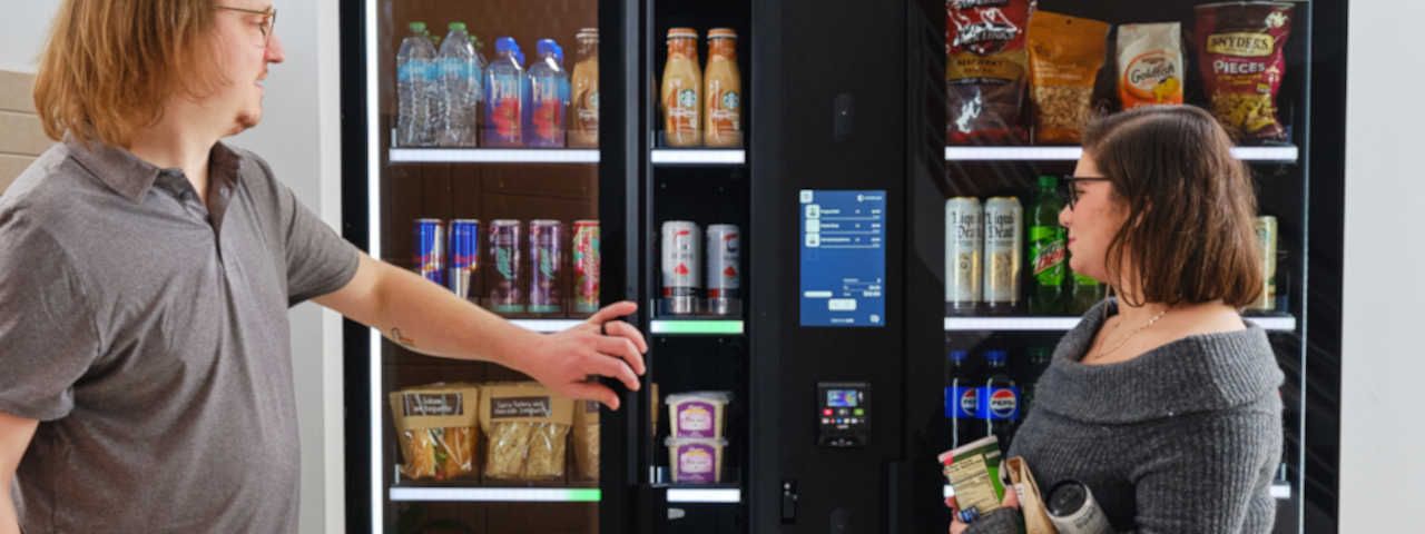 Rt side | Man opening beverage door for friend
