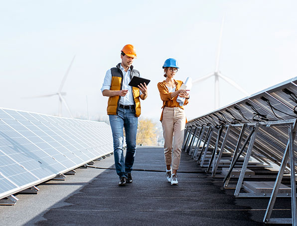 woman-man-hardhats-solar-panels.jpg