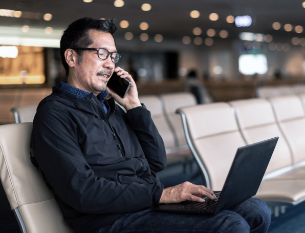 Card | Business traveler working