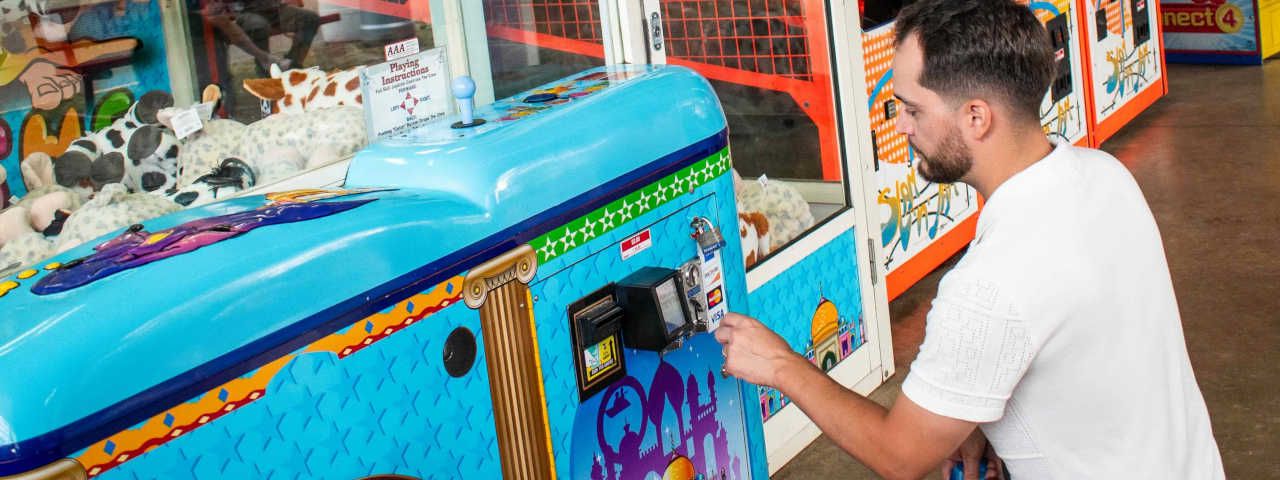 Rt side image | Man using card reader for games