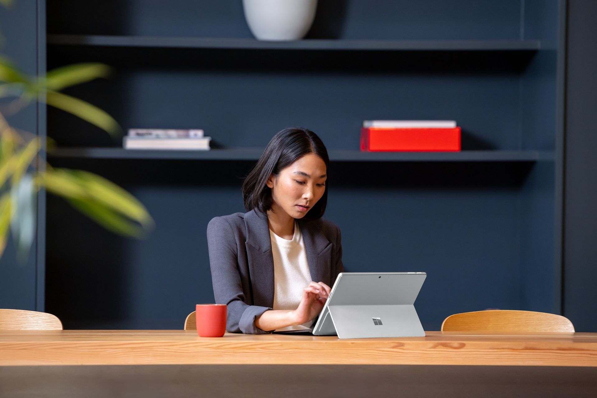asian woman sitting tablet.jpg