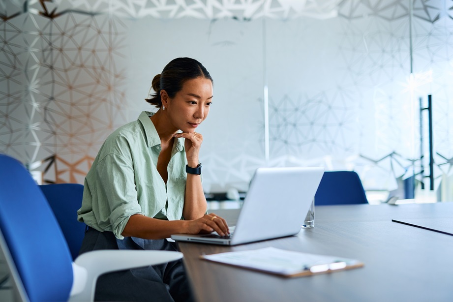 asian woman sitting laptop.jpg